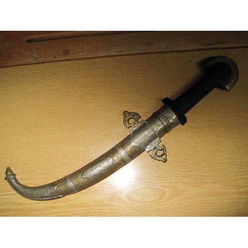 189 - An antique Arabic dagger in ornate scabbard