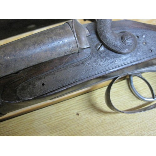 181 - A Victorian Worsley & Griffiths pin-fire 12 gauge shotgun. This is an exempt weapon and no firearms ... 