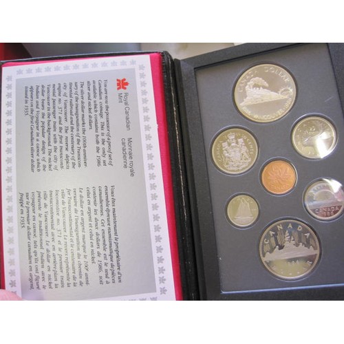 101 - A pair of cased Canadian proof sets dating to 1985 and 1986, in original packaging and including ori... 