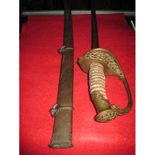 188 - An antique sword with USN cast into handguard, with metal scabbard, scabbard a/f (split to shaft), c... 