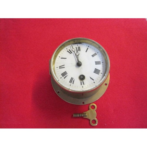 330 - A ship's bulkhead clock with enamel dial