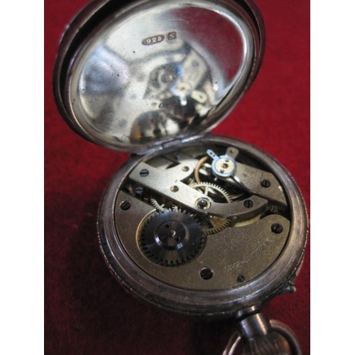 326 - A ladies Swiss .925 silver pocket watch, the case ornately engraved, the dial picked out in gold on ... 