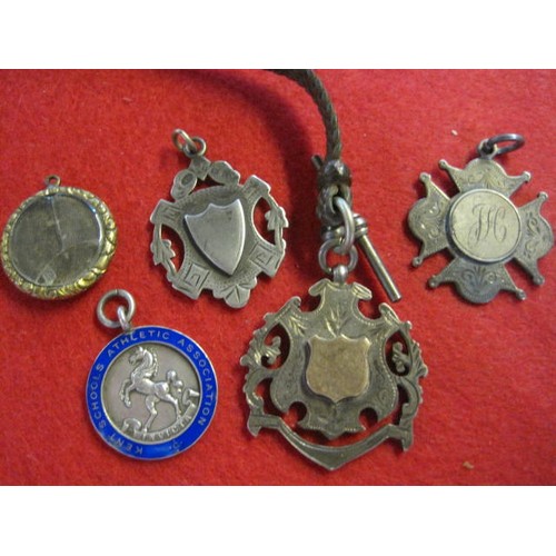 286 - Three sterling silver Victorian & Edwardian watch fobs, all hallmarked, one with plain yellow metal ... 