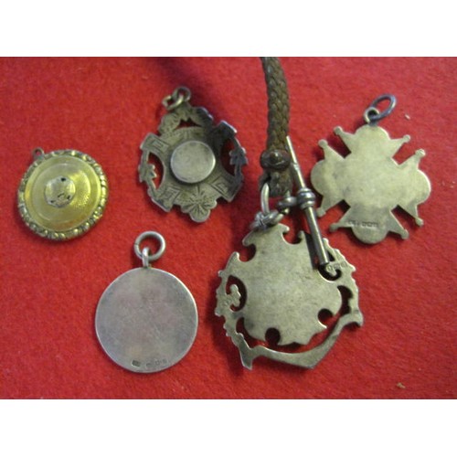 286 - Three sterling silver Victorian & Edwardian watch fobs, all hallmarked, one with plain yellow metal ... 