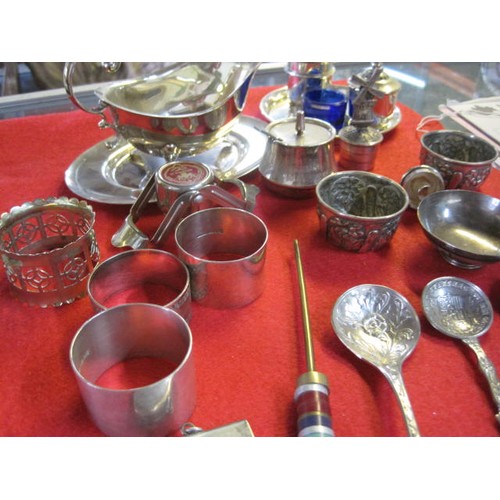 289 - An Egyptian 1920s/30s silver cup and an assortment of silver plated condiment sets, gravy boats, nap... 