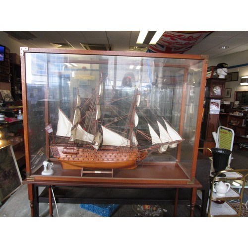 198 - A very large model of HMS Victory in a floor-standing glass case on stand. Approx. 45