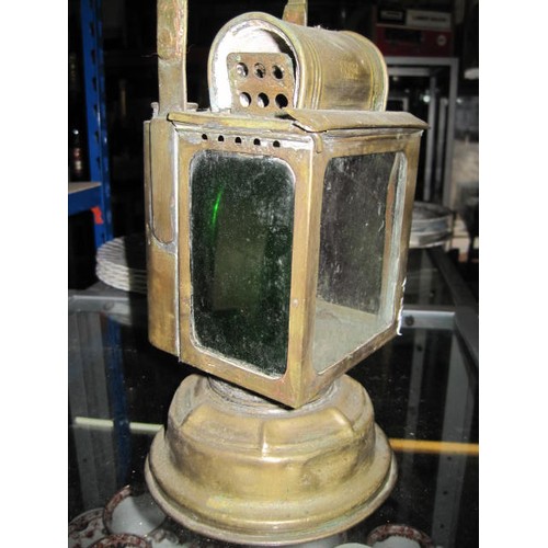 268 - A French Railway Lamp by Albert Butin, triple aspect, with red and green coloured side glasses, the ... 