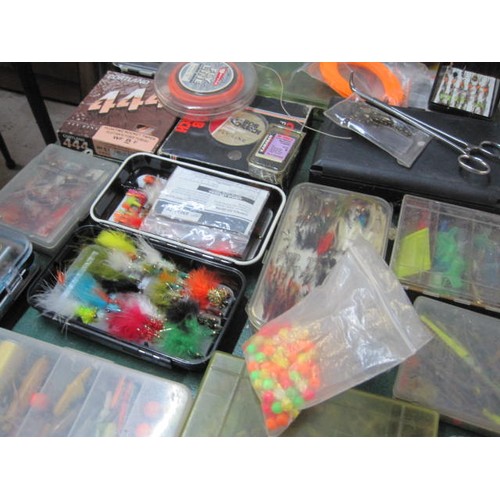 240 - A very large assortment of trout flys and others, spread across various cases, plus an assortment of... 