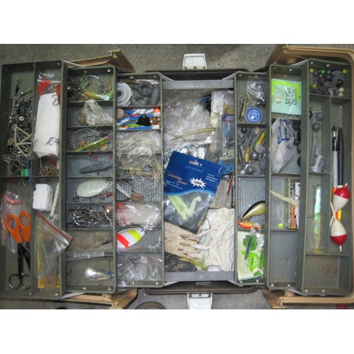 243 - A large plastic cantilever toolbox containing mixed fishing tackle including floats, lures, hooks, w... 