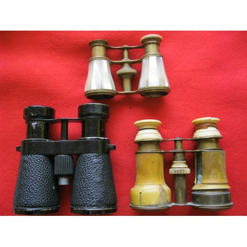 174 - 3 pairs of binoculars: a pair of black field glasses in good order, a pair of binoculars with ivory ... 