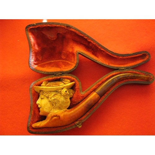 260 - A cased antique smoker's Meerschaum pipe, the bowl carved into the shape of a Victorian lady. Carvin... 