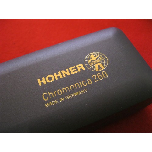 210 - A cased Hohner Chromonica 260 harmonica