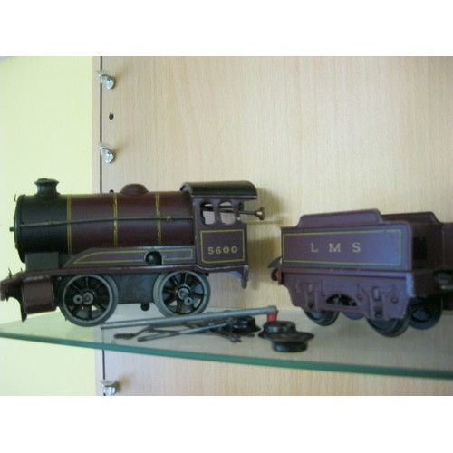 271 - A Hornby 0-4-0 LMS Clockwork O Gauge Engine with Tender and 3 Coaches, coupling rods removed but pre... 