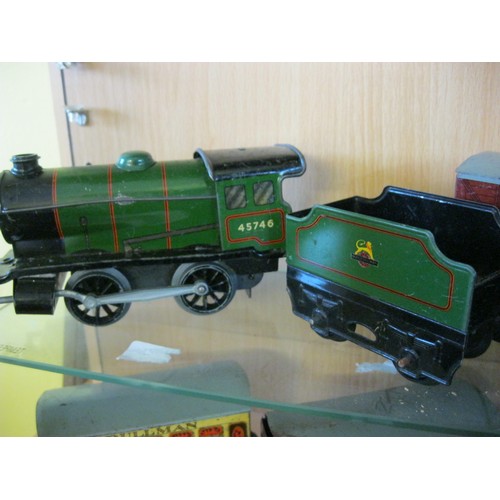 272 - A Hornby Type 20 Clockwork Locomotive and tender, plus two coaches and two wagons, working