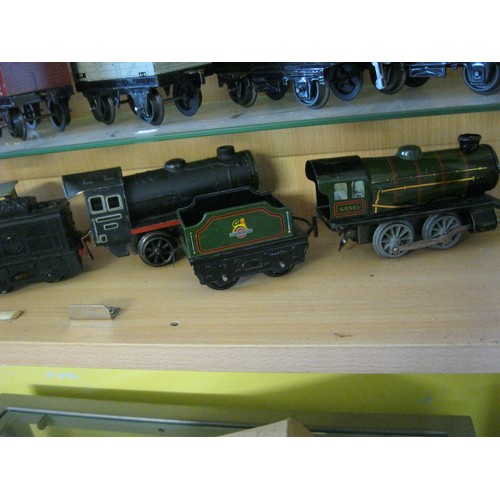 273 - A pair of clockwork Brittoy Locomotives, one tin-bodied, the other plastic, plus 2 coaches