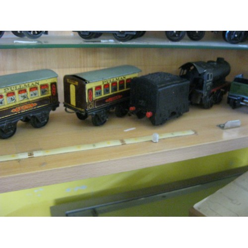 273 - A pair of clockwork Brittoy Locomotives, one tin-bodied, the other plastic, plus 2 coaches