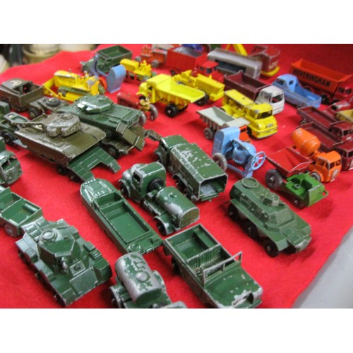 308 - An assortment (approx 40) of vintage Matchbox & Lesney toy cars and trucks comprising military and c... 