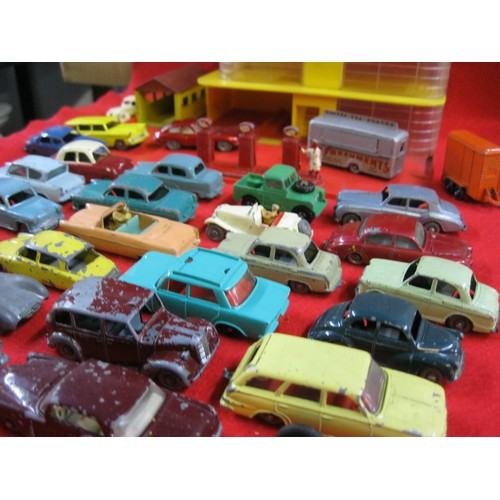 310 - A vintage Matchbox garage and an assortment of vintage Matchbox and Lesney toy cars (approx 30) in m... 