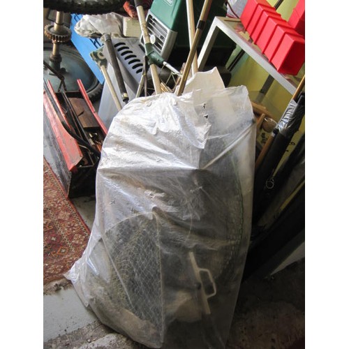 245 - A large bundle of various fishing nets comprising keep nets and landing nets etc