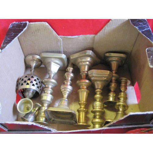 28 - Pair of fire dogs, box of brass candlesticks etc.