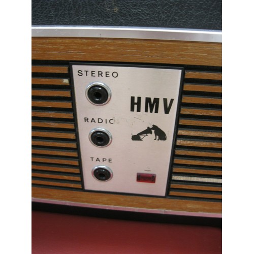 115 - A vintage HMV Model 2040 Portable Record Player in excellent cosmetic condition, one small rip to pa... 