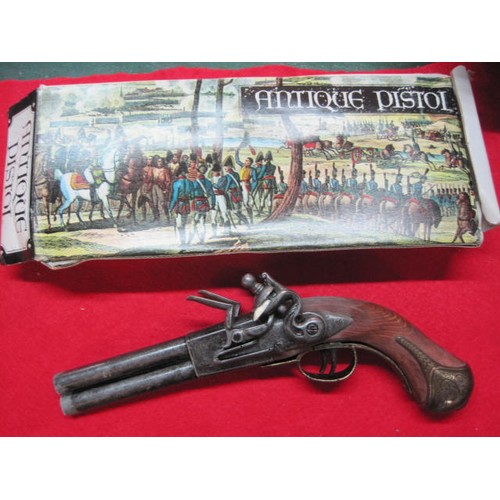 152 - Boxed Spanish-made replica James Barbar double-barrelled flintlock pistol. Slight damp damage to box... 