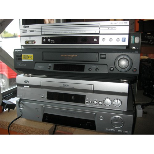 107E - A stack of VHS video cassette recorders by Sony, JVC and others, either unmarked or marked as workin... 