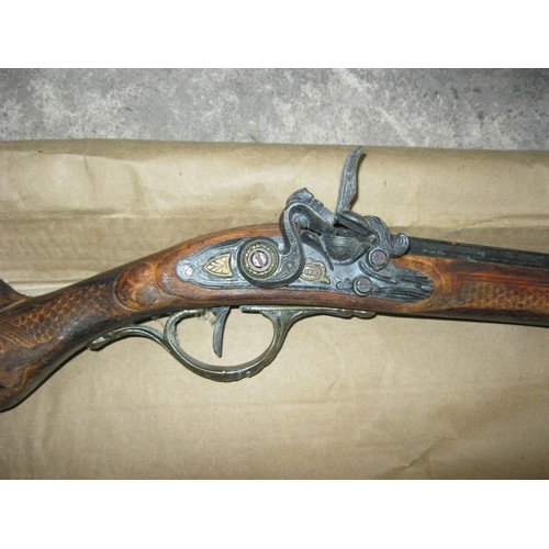 183 - A Denix replica flintlock rifle depicting an 18th/19th century Flintlock, possibly French, in good o... 