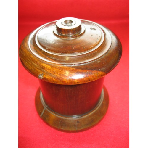 200 - A 19th century lignum vitae string box of traditional round design in good order with wear commensur... 