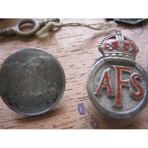 135A - A small wooden box containing various RNR buttons, Auxiliary Fire Service badges and ID tags, Somers... 