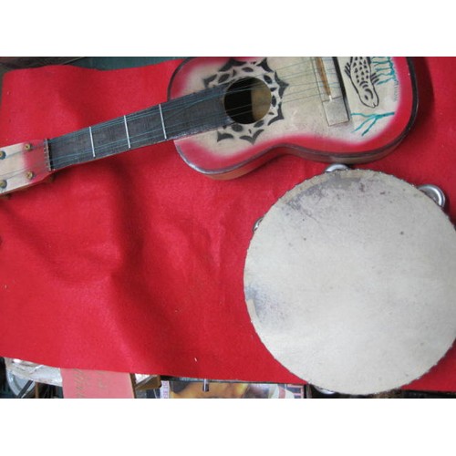 145 - A vintage painted ukelele and a vintage tambourine