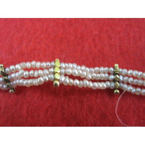 176 - An attractive seed pearl necklace with gilt fittings. The necklace has been previously shortened and... 