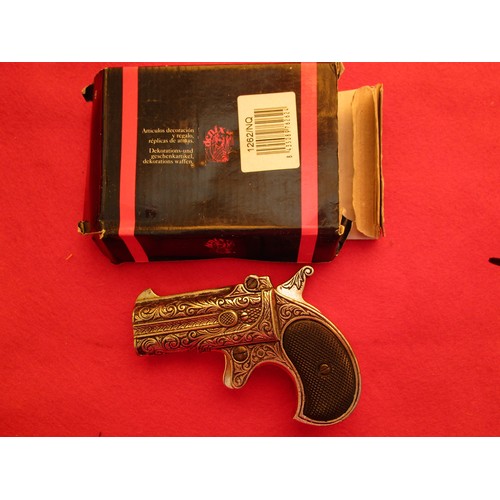 191 - A Denix 1262NQ replica1862 double-barrelled Derringer, boxed, some damp damage to box but weapon goo... 