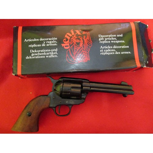 203 - A Denix 1186N replica 1873 Colt Peacemaker .45 Calibre pistol, damp damage to box and minor marks to... 