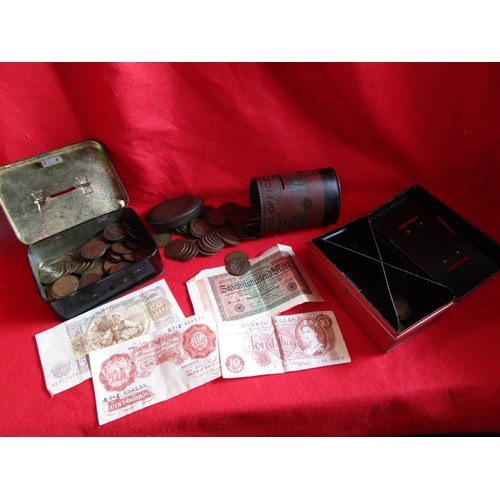 114 - A George V postbox style moneybox and two old cash tins containing a quantity of old pennies plus a ... 