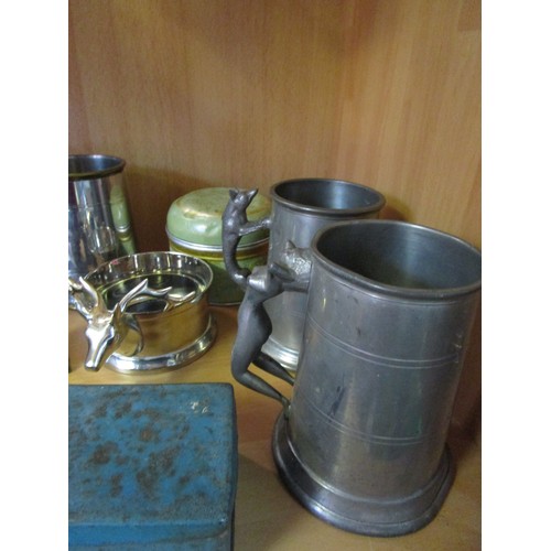 18 - An assortment of copperware, brassware, pewter and others including a wine coaster with stag's head ... 