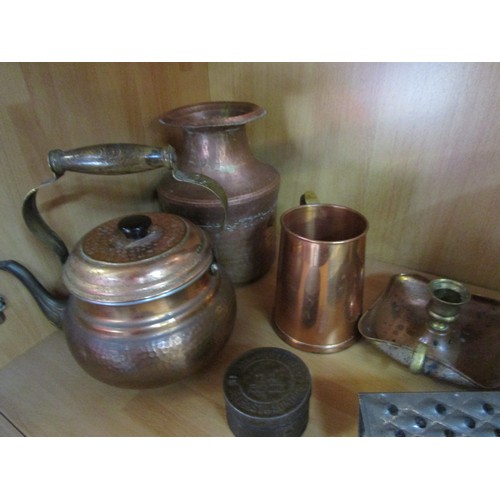 18 - An assortment of copperware, brassware, pewter and others including a wine coaster with stag's head ... 