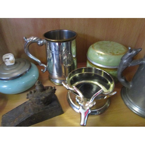 18 - An assortment of copperware, brassware, pewter and others including a wine coaster with stag's head ... 