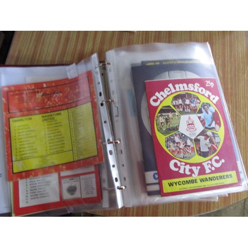 135 - A folder of FA Cup football programmes dating from the 50's to modern covering various teams, in FA ... 