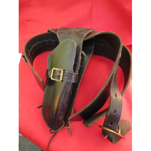 227 - A heavy gunbelt and holster in black leather, in good order except stitching failed at joint and wil... 