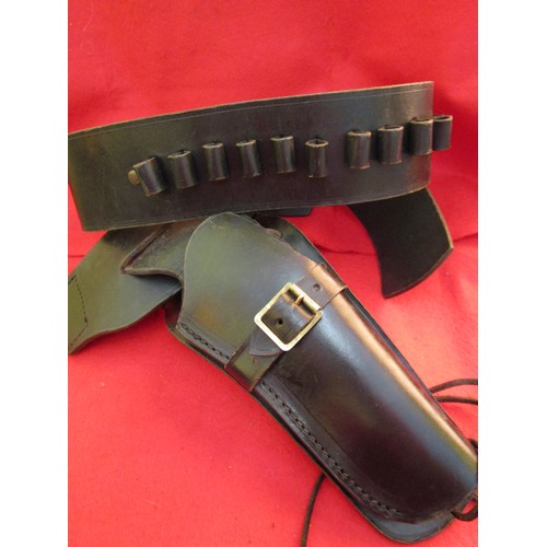 227 - A heavy gunbelt and holster in black leather, in good order except stitching failed at joint and wil... 