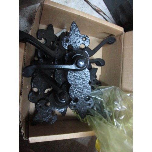 25A - A crate containing a large quantity of black antique style door furniture comprising handles, latche... 