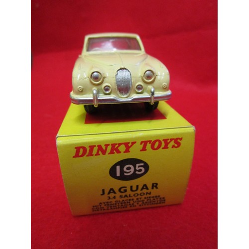 104 - Dinky Jaguar 3.4 saloon #195, boxed, finished in cream with red interior, immaculate.