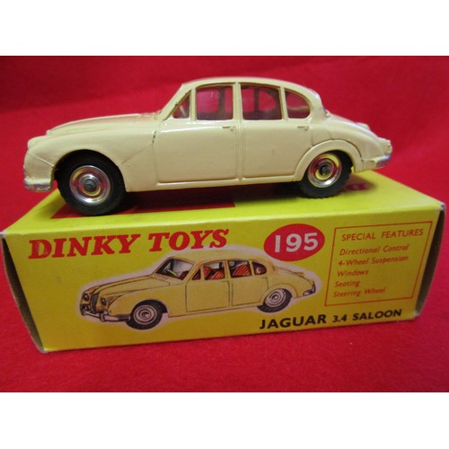 104 - Dinky Jaguar 3.4 saloon #195, boxed, finished in cream with red interior, immaculate.