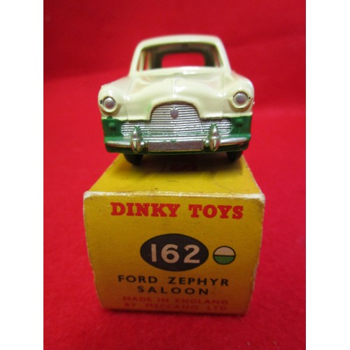 107 - Dinky Toys #162 Ford Zephyr Saloon, boxed, finished in cream over green. Wear and minor damage to bo... 