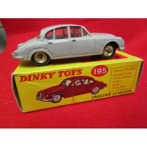 110 - Dinky Toys #195 Jaguar 3.4 Saloon, boxed, finished in grey with red interior. Box very good, vehicle... 