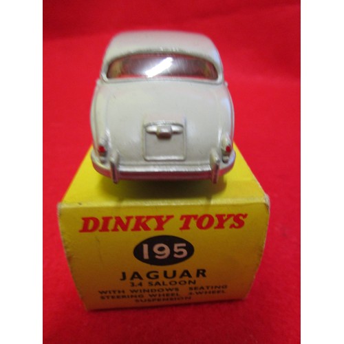 110 - Dinky Toys #195 Jaguar 3.4 Saloon, boxed, finished in grey with red interior. Box very good, vehicle... 