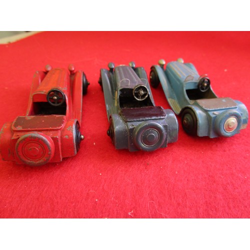 130 - 3 x Dinky Toys 38f Jaguar SS100, unboxed, red, light blue and dark blue examples.