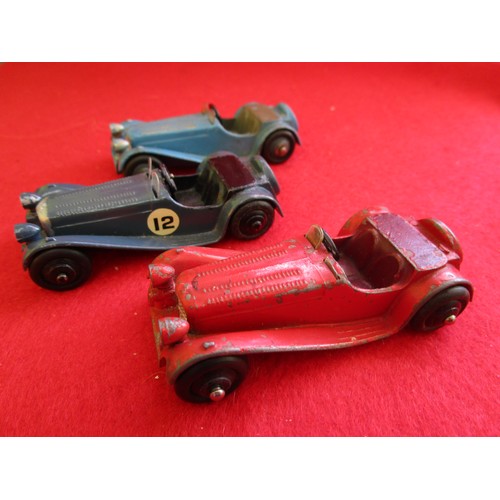 130 - 3 x Dinky Toys 38f Jaguar SS100, unboxed, red, light blue and dark blue examples.