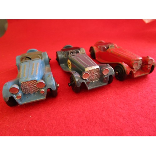 130 - 3 x Dinky Toys 38f Jaguar SS100, unboxed, red, light blue and dark blue examples.